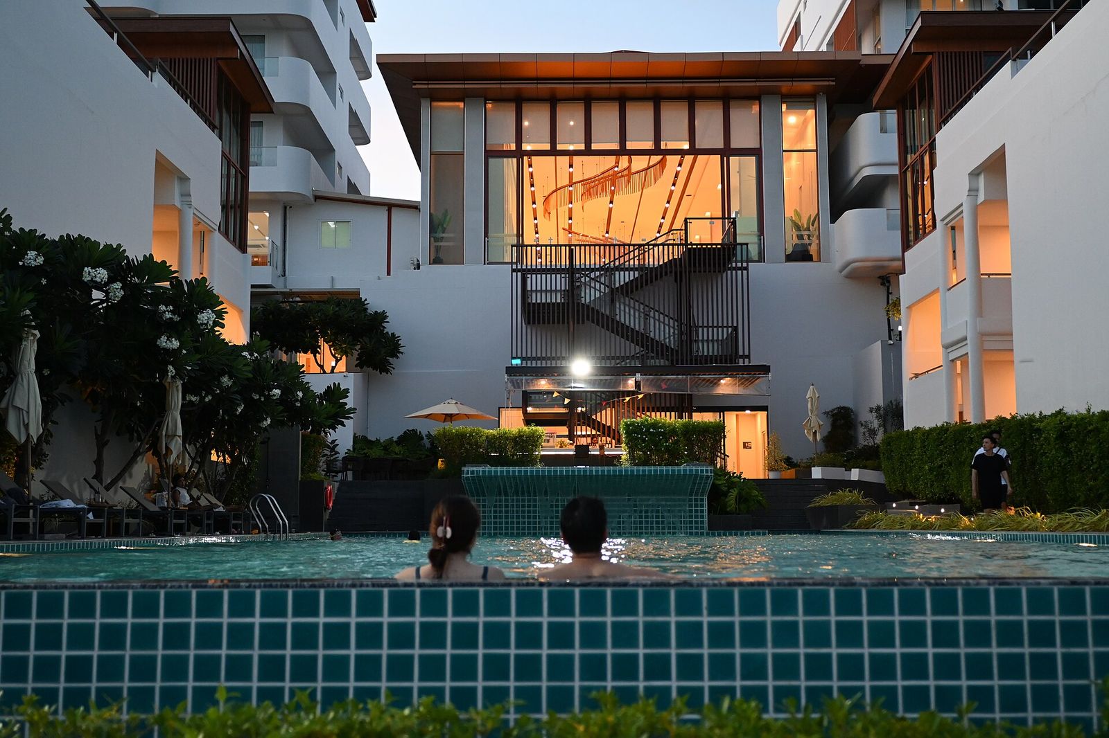 A resort pool at dusk